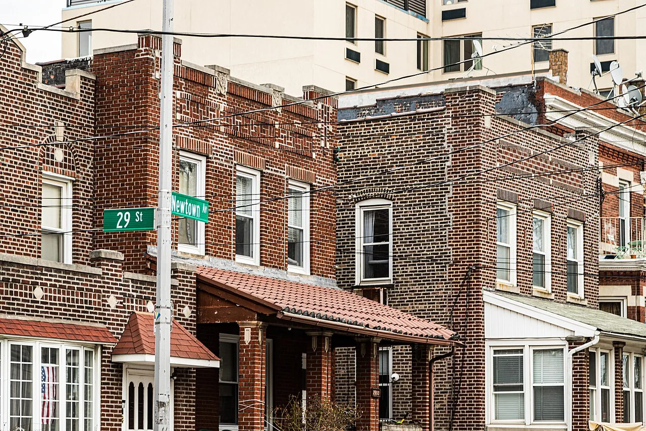 Brick rowhouses and commercial streets in Queens